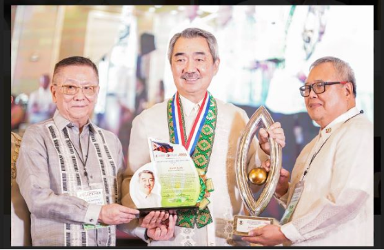 Mr. Hans T. Sy as he receives his TOFIL plaque and trophy | SM Supermalls