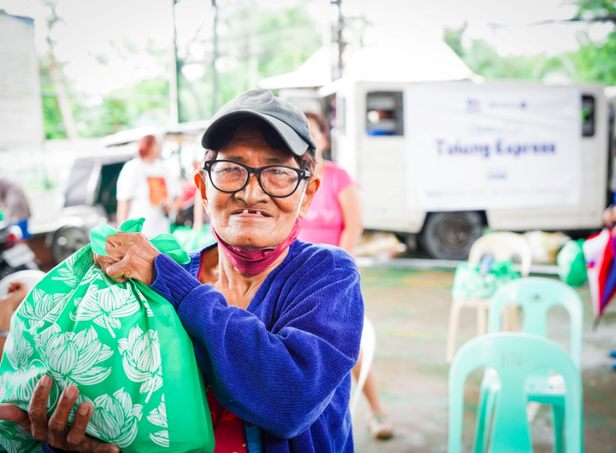 An elderly receiving a relief pack from SM Foundation Inc. through SM City Baliwag | SM Supermalls